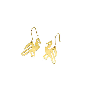 A pair of gold brass earrings in the shape of a bird, photographed against white background. 