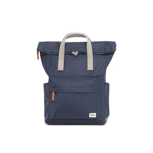 Navy Blue rucksack by ROKA photographed with white background.