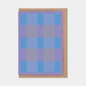 Greetings card featuring abstract purple and blue check design. Brown envelope.
