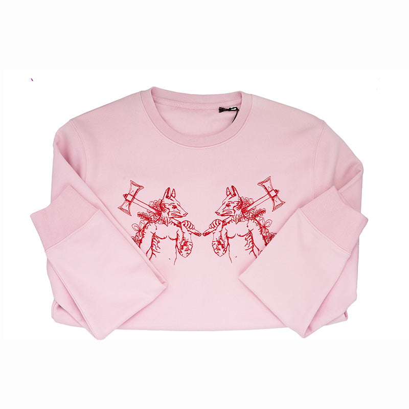 Pink jumper with werewolves embroidered on the chest. Folded.