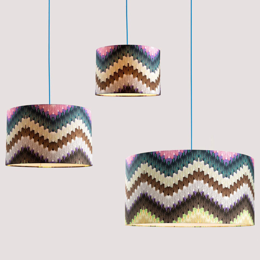 Three lampshades featuring a zig zag colourful pattern designed by Timorous Beasties.