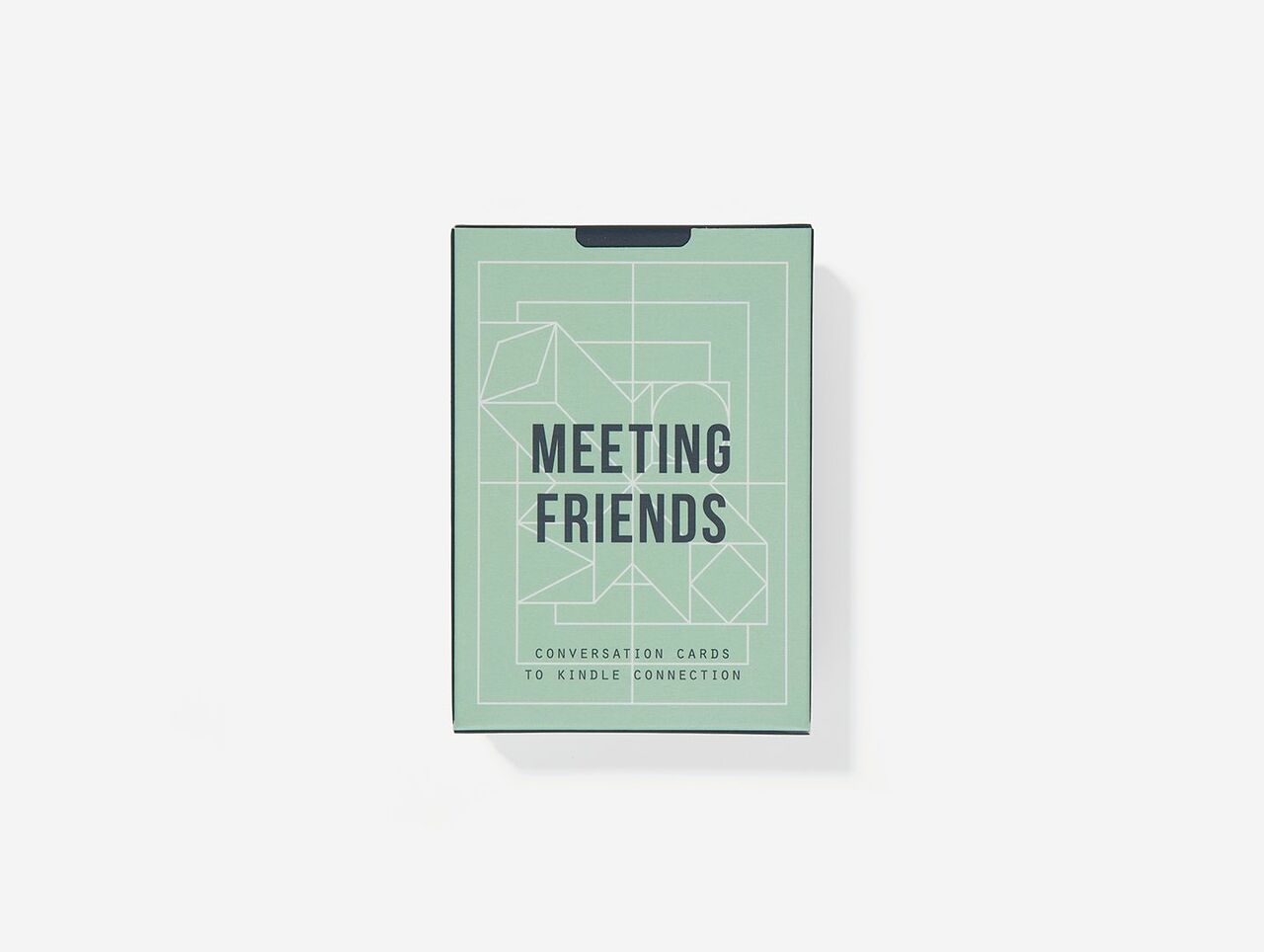 Image of a green box of cards with the words 'MEETING FRIENDS' laid on top of a white geometric line pattern.