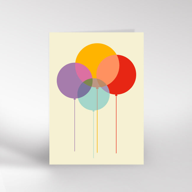 Greetings card with colourful balloons on a light yellow background