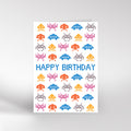 Birthday card with pixelated space invaders design and 'Happy Birthday' text on a white background.