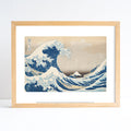 Framed artwork of a wave with Mount Fuji, similar to 'The Great Wave off Kanagawa'.