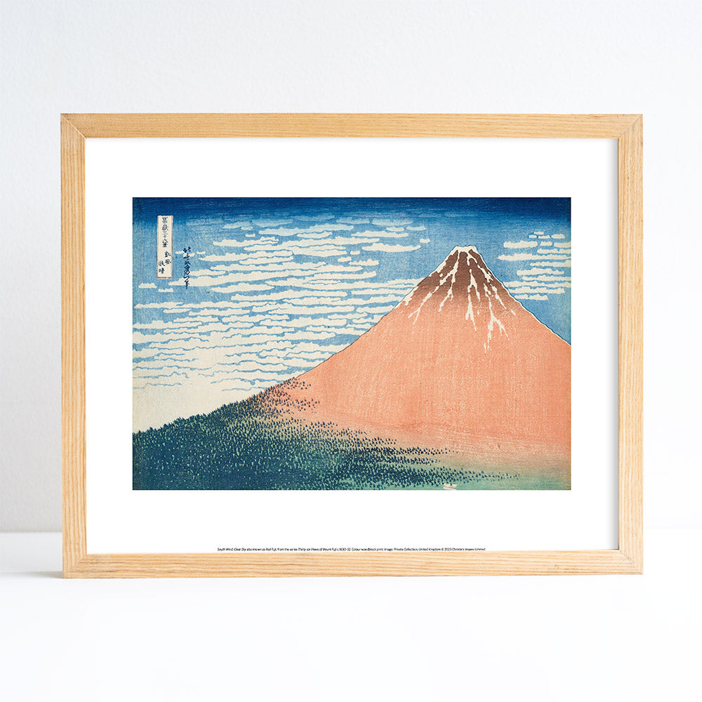Framed artwork of a mountain landscape with a wooden frame.