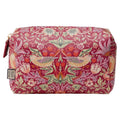 A rectangular cosmetic pouch with a red background and a detailed floral and bird pattern in pink, green, and yellow, featuring a gold zipper and a small hanging brand tag.