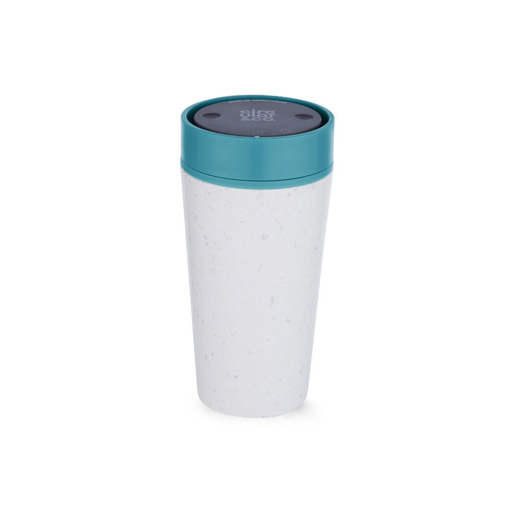 A white reusable coffee cup with a teal lid and a small circular logo on top.