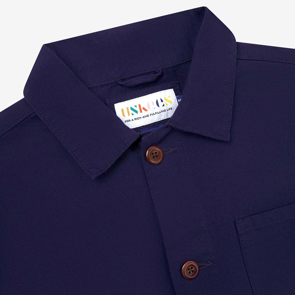 Navy shirt with a visible brand label on a white background