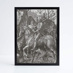 Albrecht Durer's Knight Death and the Devil etching, featuring a knight on a horse with various figures and landscape surrounding them. Photographed against a white background in a black frame.