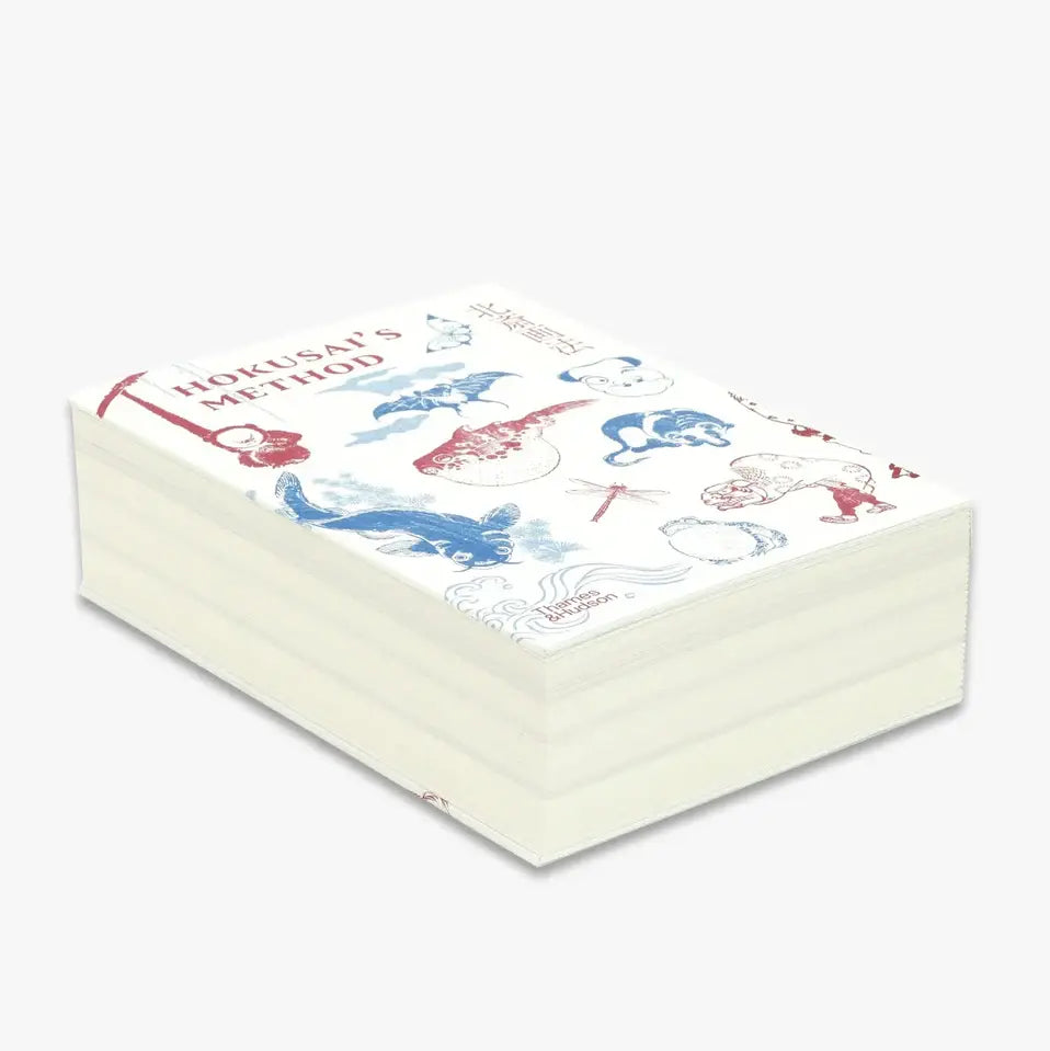 Book cover with illustrations of details from famous Hokusai's artworks. Laid on its side.