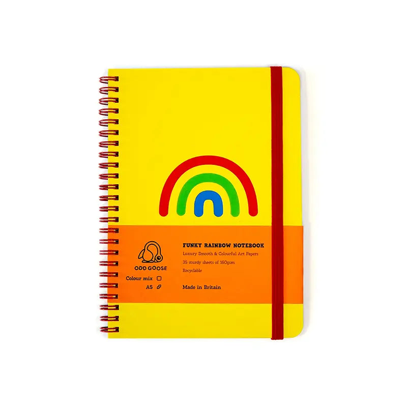 Yellow notebook with a rainbow illustration, presented against a white backdrop.