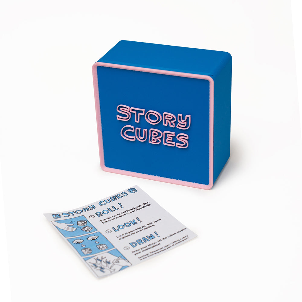 Blue cubes with different pictures embellished on them. Photographed against a white background.