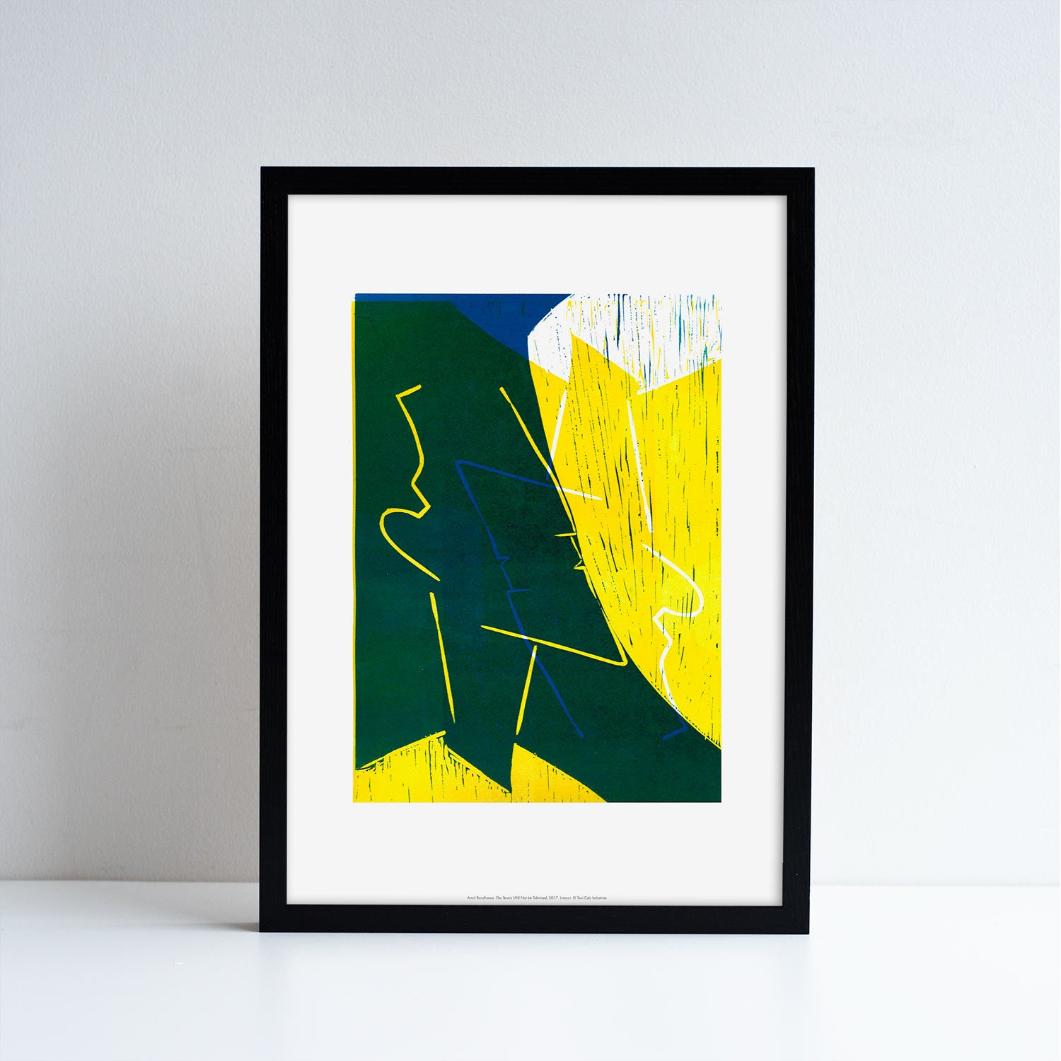 An printed reproduction of an artwork by Amrit Randhawa. Green, yellow, white and blue graphic work. Placed in a black frame.