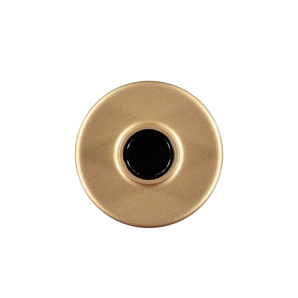 A gold-coloured candle holder with a wide, flat base and a narrow, cylindrical top, viewed from the top.