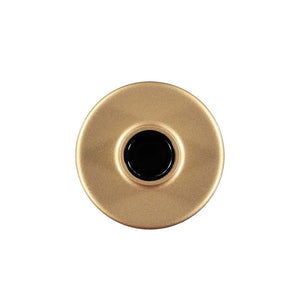 A gold-coloured candle holder with a wide, flat base and a narrow, cylindrical top, viewed from the top.