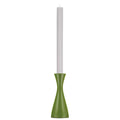 Green candle holder with a white candle on a white background