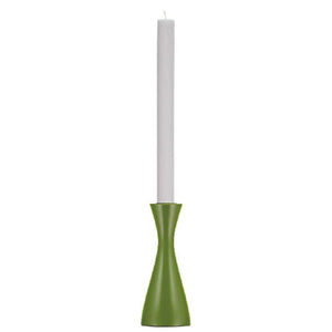 Green candle holder with a white candle on a white background