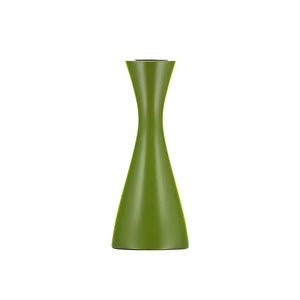 Cylindrical green candle holder on a white background