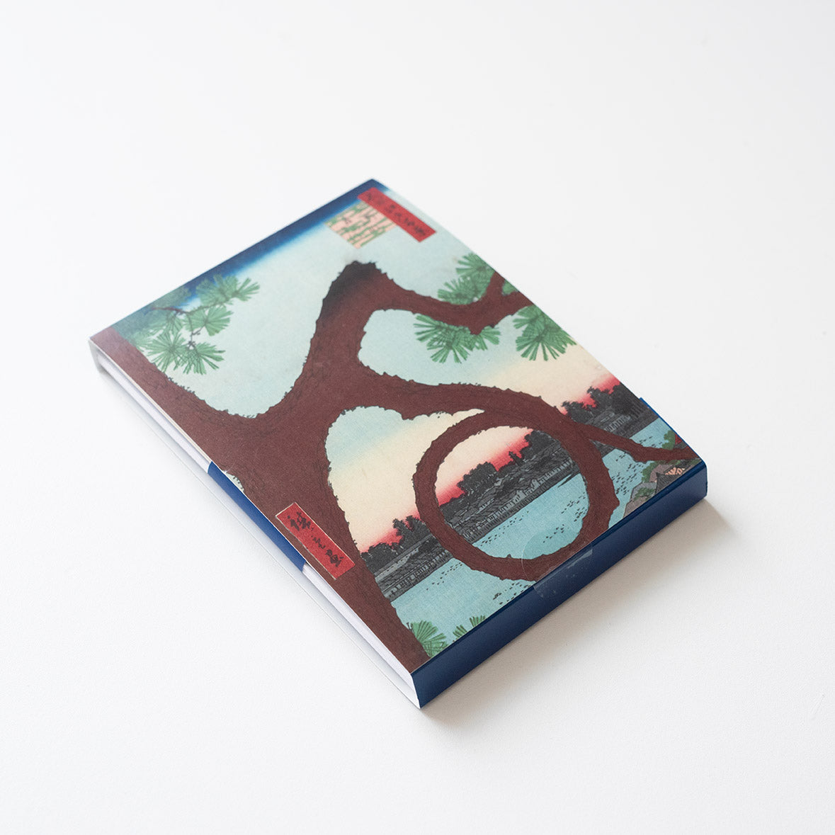 Front cover of set of greetings cards. Features a Japanese Woodblock design with a tree - presented on a light grey background