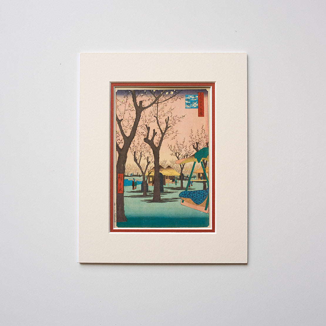 Mounted artwork of a cherry blossom tree scene on a light grey background