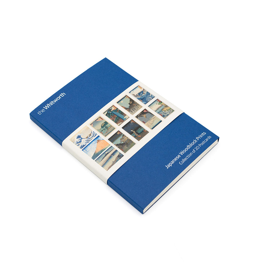 Front cover of postcard set with Japanese woodblock print designs on a navy background