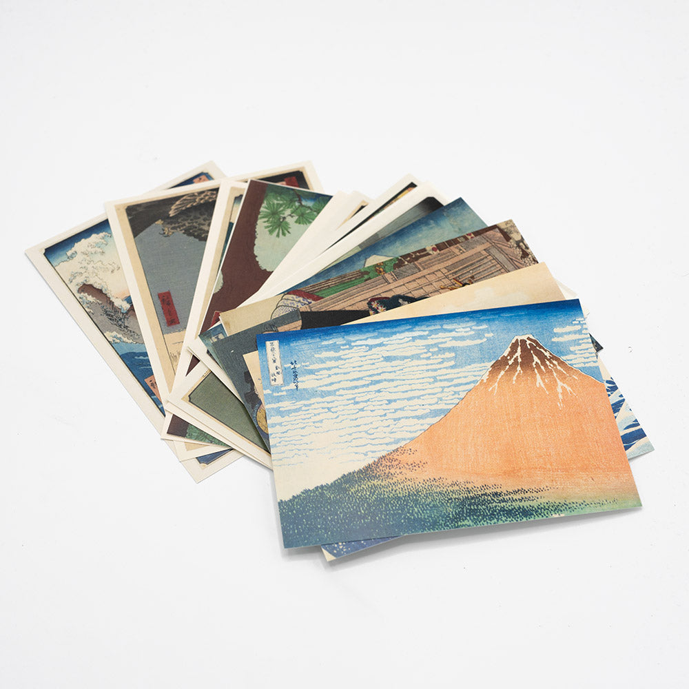 Set of postcards presented in a fan shape on a white background