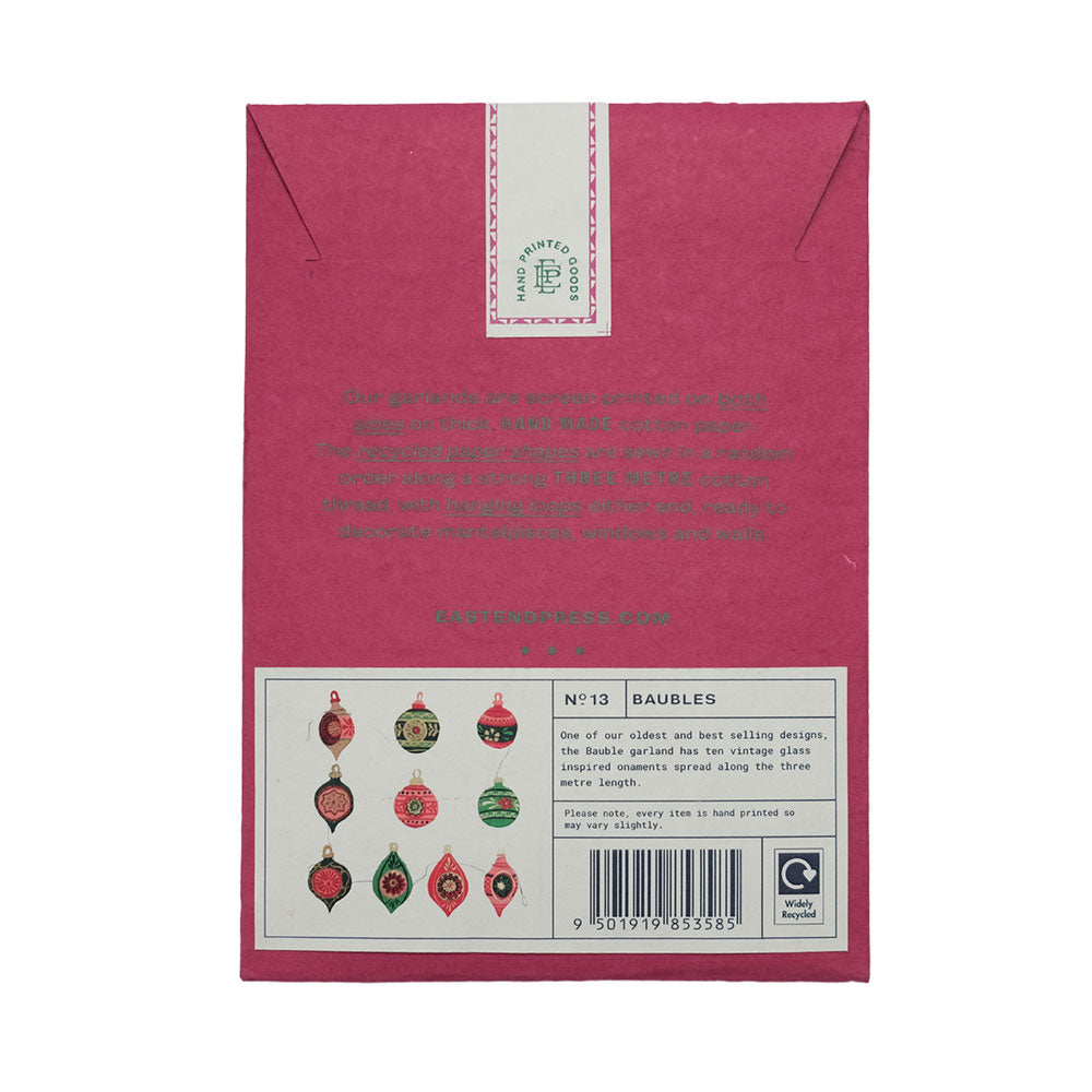 Back of a pink packaging box with product details and icons on a white background