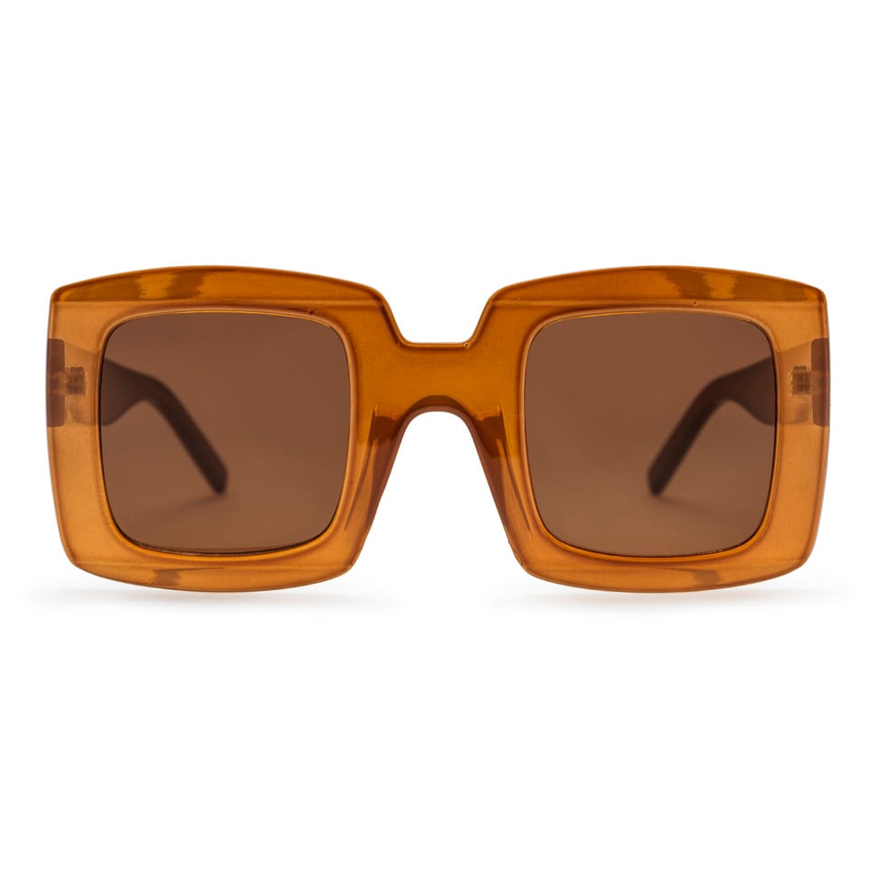 Mustard sunglasses with a transparent frame on a white background