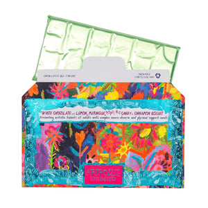 Bright and colourful packaging for a rectangular chocolate bar, featuring an artwork by Arthouse Unlimited artist. The chocolate wrapped in green foil is popping out of the packaging in view.