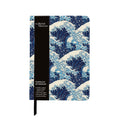 Journal with branded British Museum belly band. Notebook features a repeat pattern of Hokusai's The Great Wave