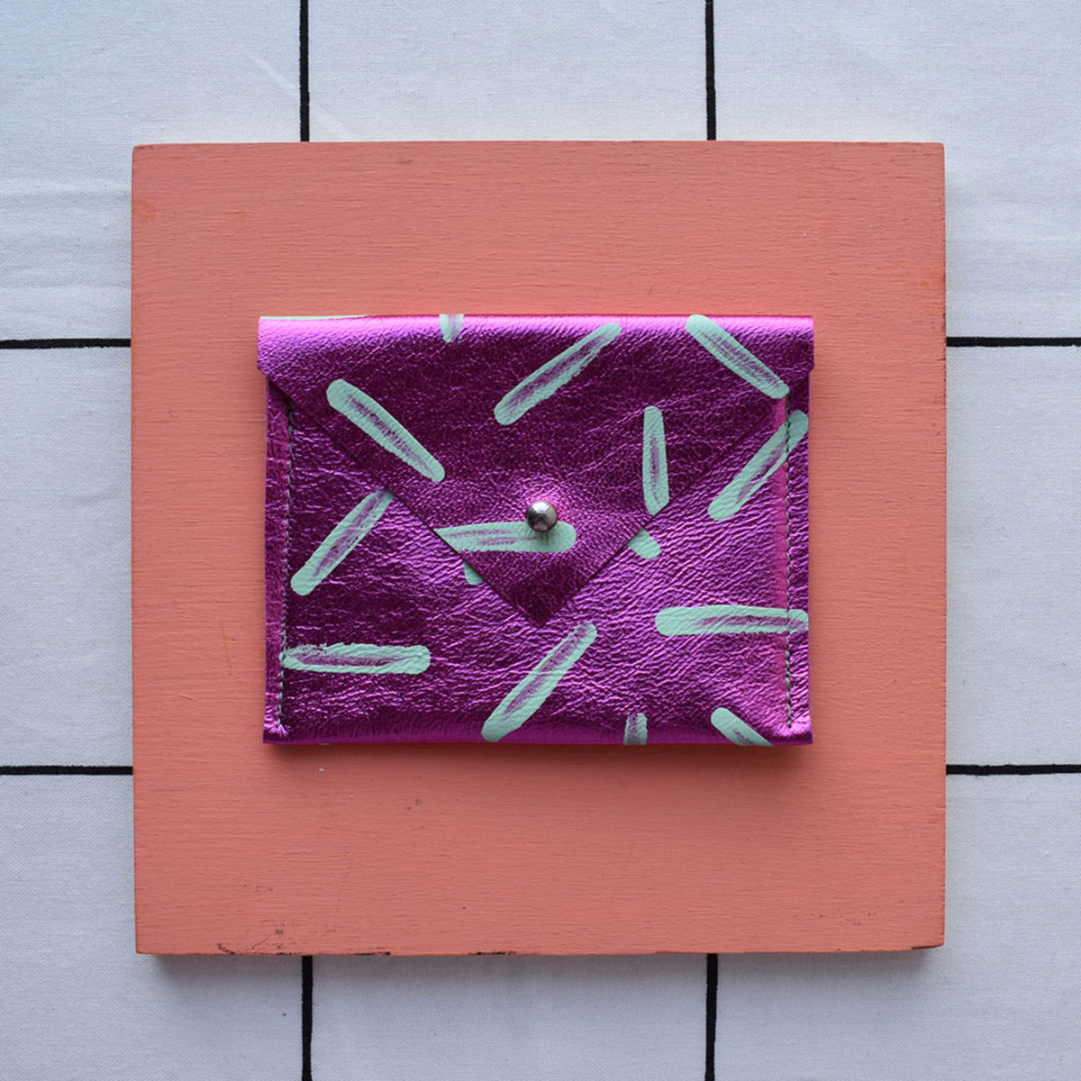 Purple metallic rectangular card pouch with hand painted design.