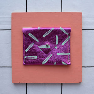 Purple metallic rectangular card pouch with hand painted design.