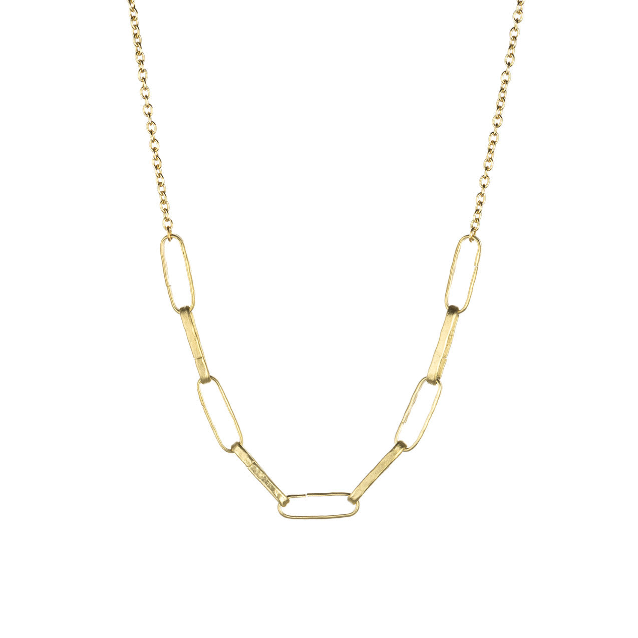 Gold chain necklace with a unique link design. The links are elongated, oval-shaped, and appear to be slightly open at one end. The chain has a delicate appearance and is likely made of a thin gauge of gold. The necklace is shown against a white background, which highlights its golden color and intricate design.