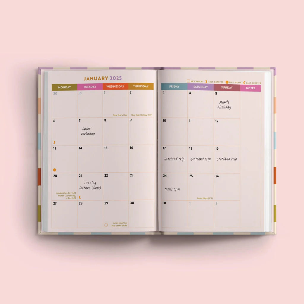 An open January 2025 diary page. The left page shows the calendar dates and days of the week. The right page has space for notes and includes information about moon phases, holidays, and personal events like Luigi's birthday and a Scotland trip.