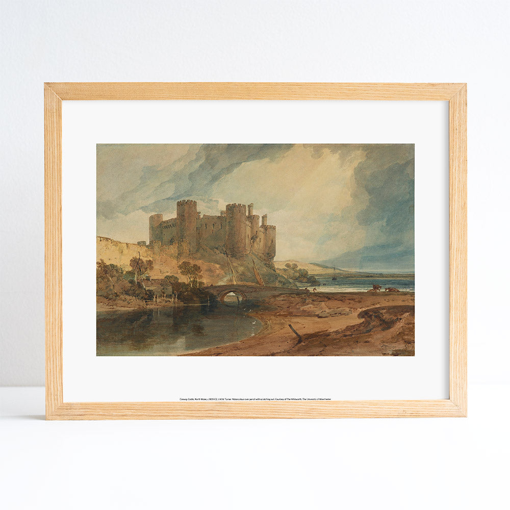 Framed artwork of a castle by a river on a white background