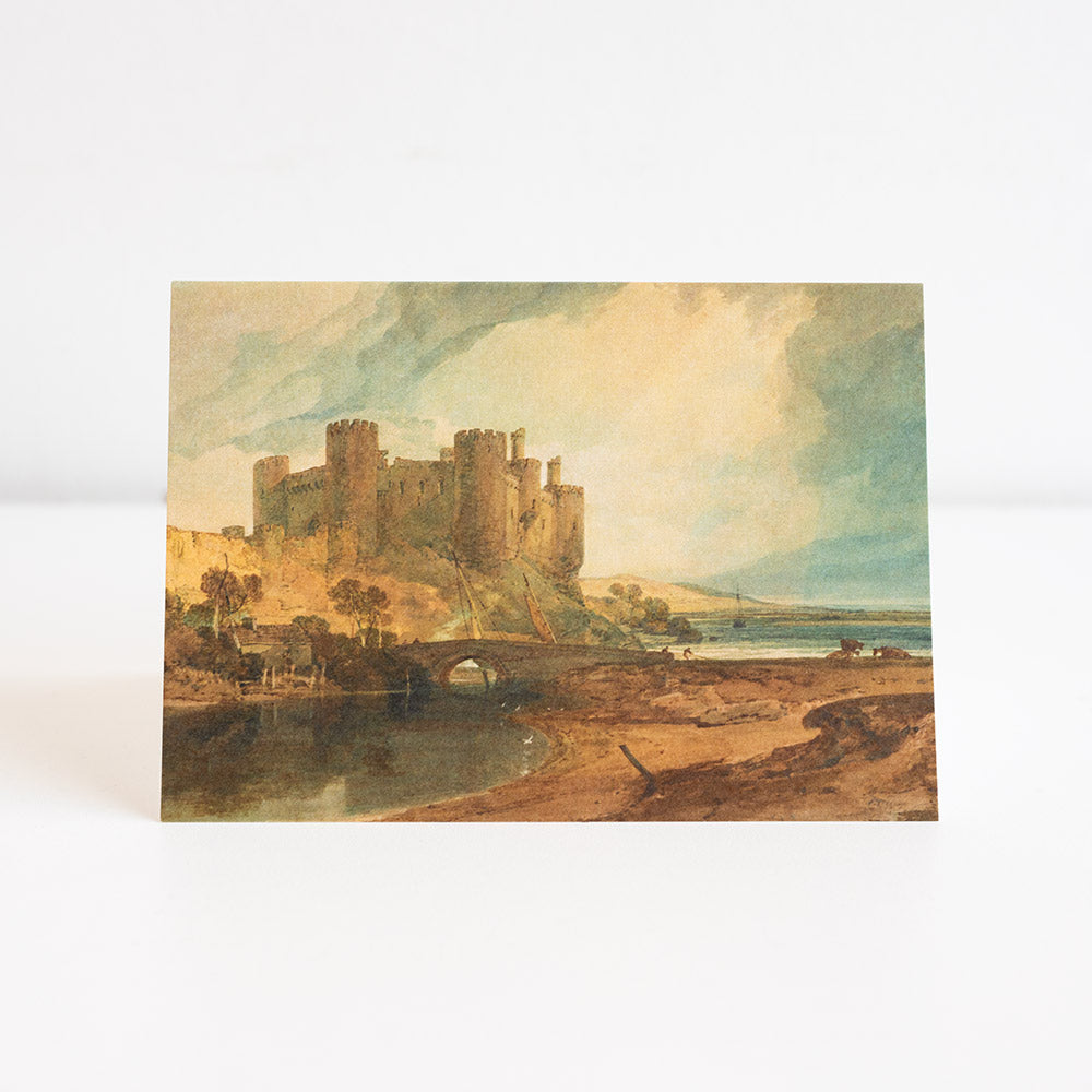Turner painting of Conway Castle ona greetings card, photographed against a white background