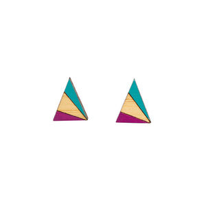 Triangular shaped earrings against white background. Made out of wood and hand-painted with blue and pink triangles/