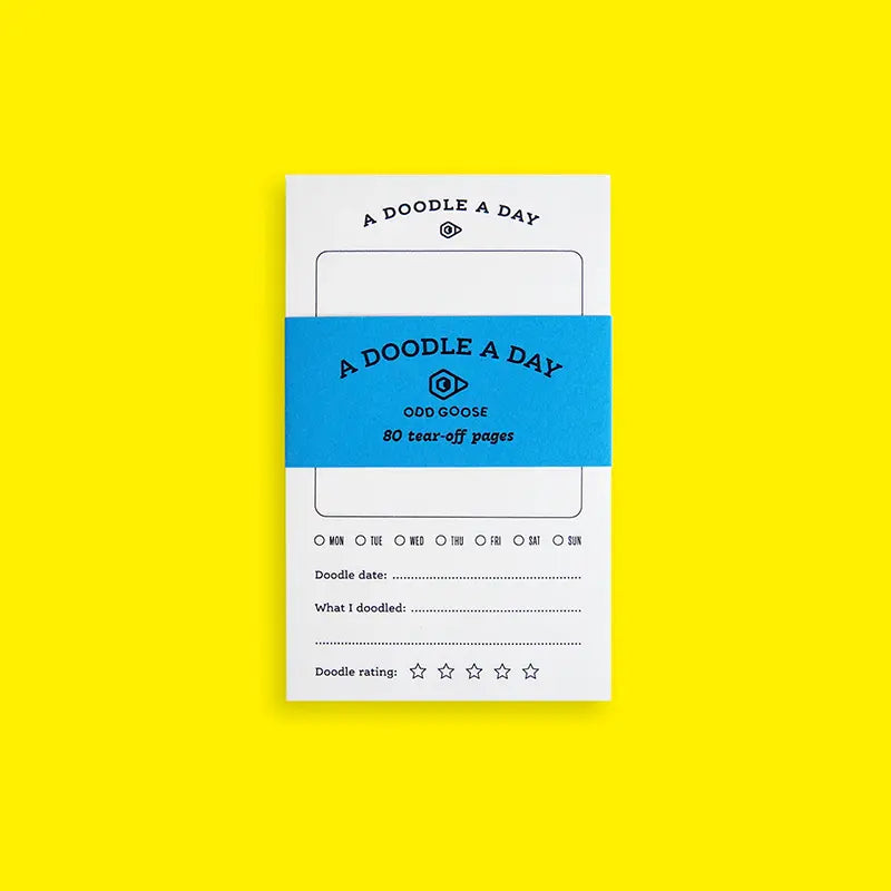 Notebook with 'A Doodle A Day' branding on a yellow background