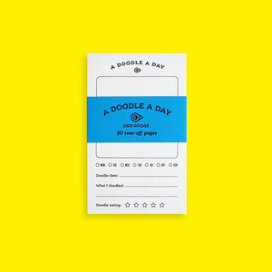 Notebook with 'A Doodle A Day' branding on a yellow background
