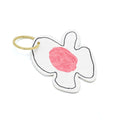 Keyring in the shape of a flower with white petals and a pink centre. Photographed in front of a white background.