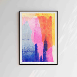 Purple, orange and pink abstract risograph print in black frame against grey wall