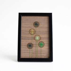 Wooden wall art with floral designs on a white background