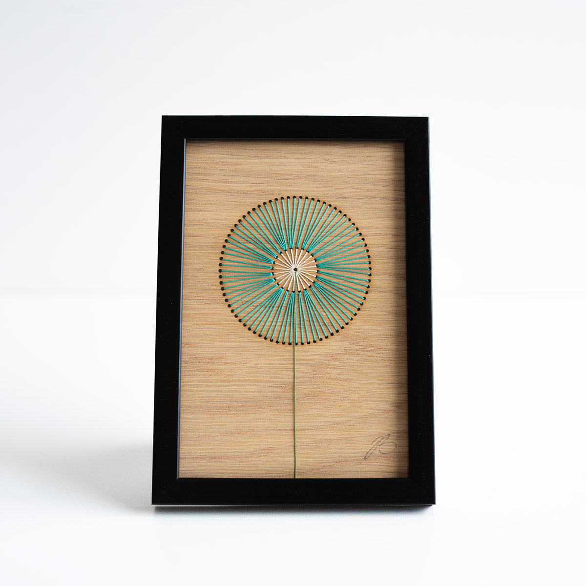 Framed artwork with a geometric design on a white background