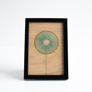 Framed artwork with a geometric design on a white background