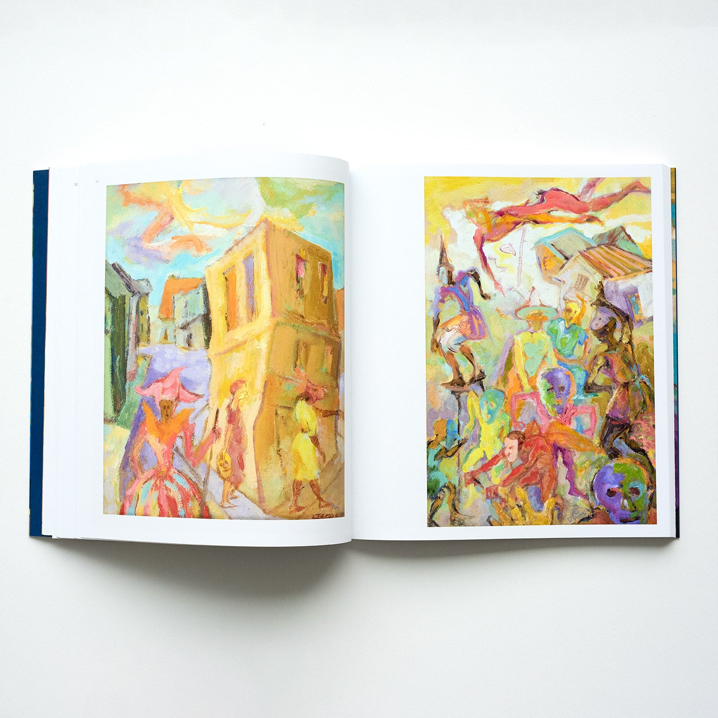 Inside pages of John Lyons catalogue featuring two vibrant paintings by the artist.
