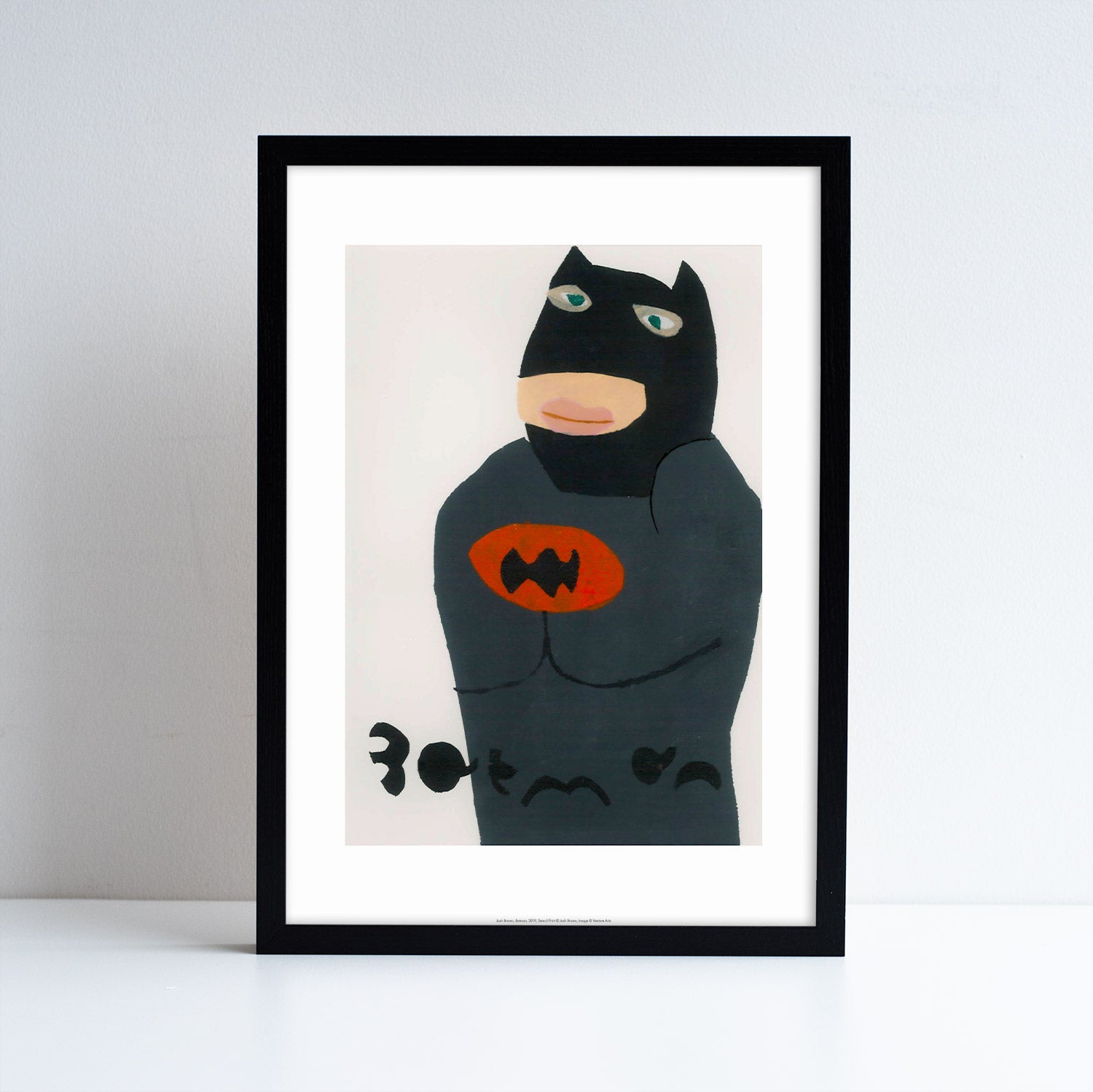 Black framed print with an print featuring artwork by Josh Brown. The print is a depiction of Batman.