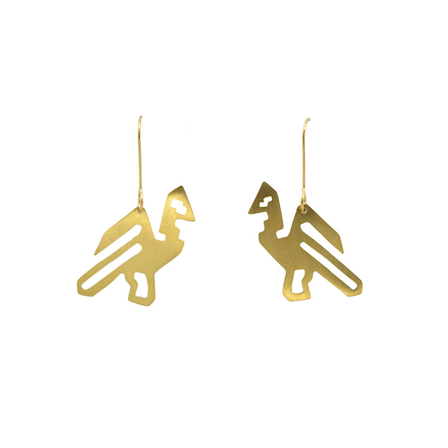 A pair of gold brass earrings in the shape of a bird, photographed against white background. 