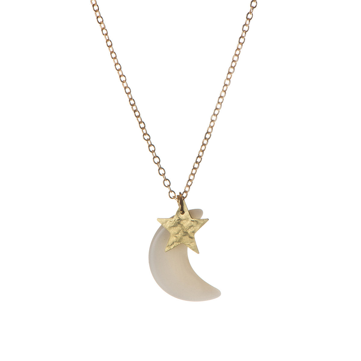 A gold necklace with a crescent moon pendant and a smaller star pendant attached to it. The moon pendant is white, while the star pendant is gold.