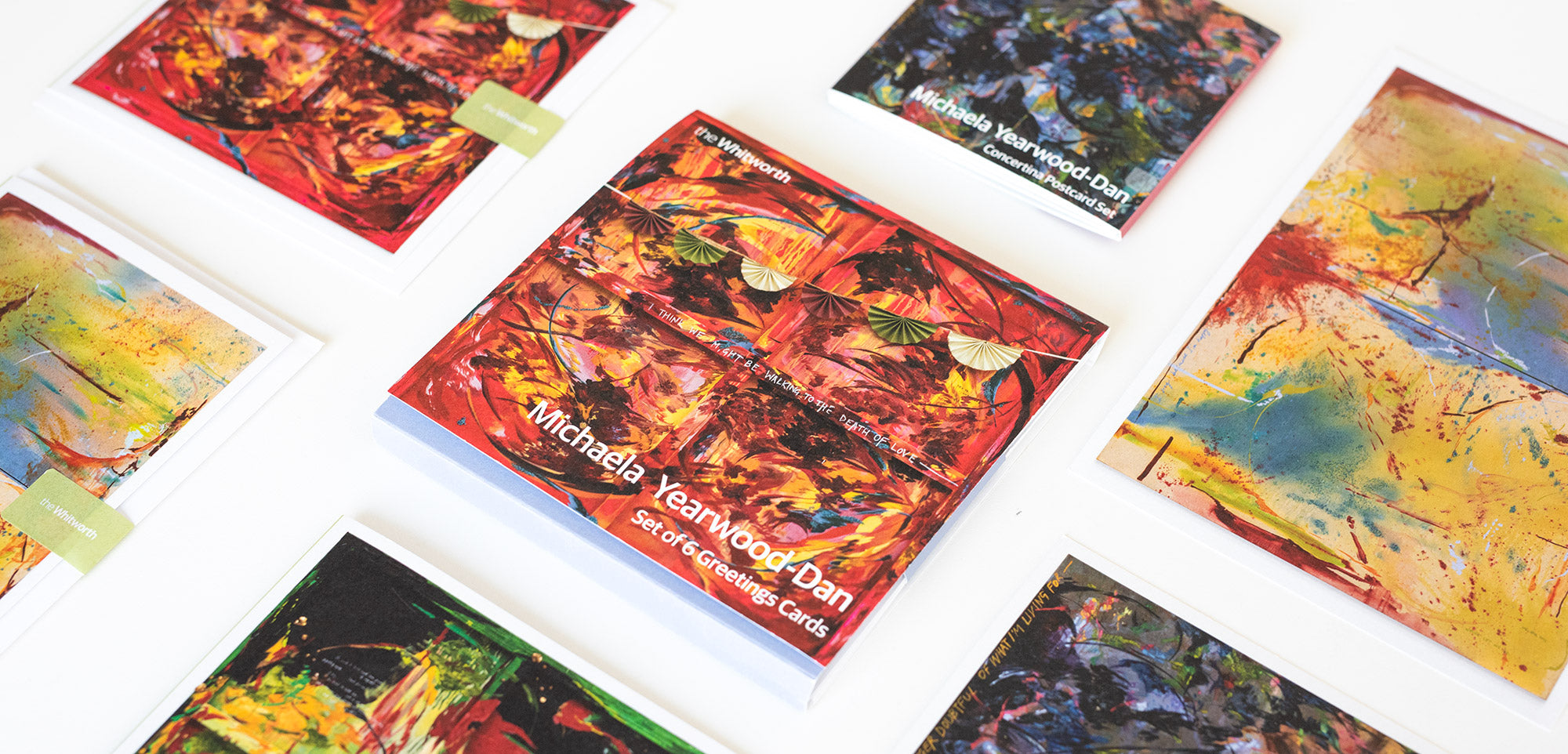 Colourful greeting cards with artistic designs on a white surface
